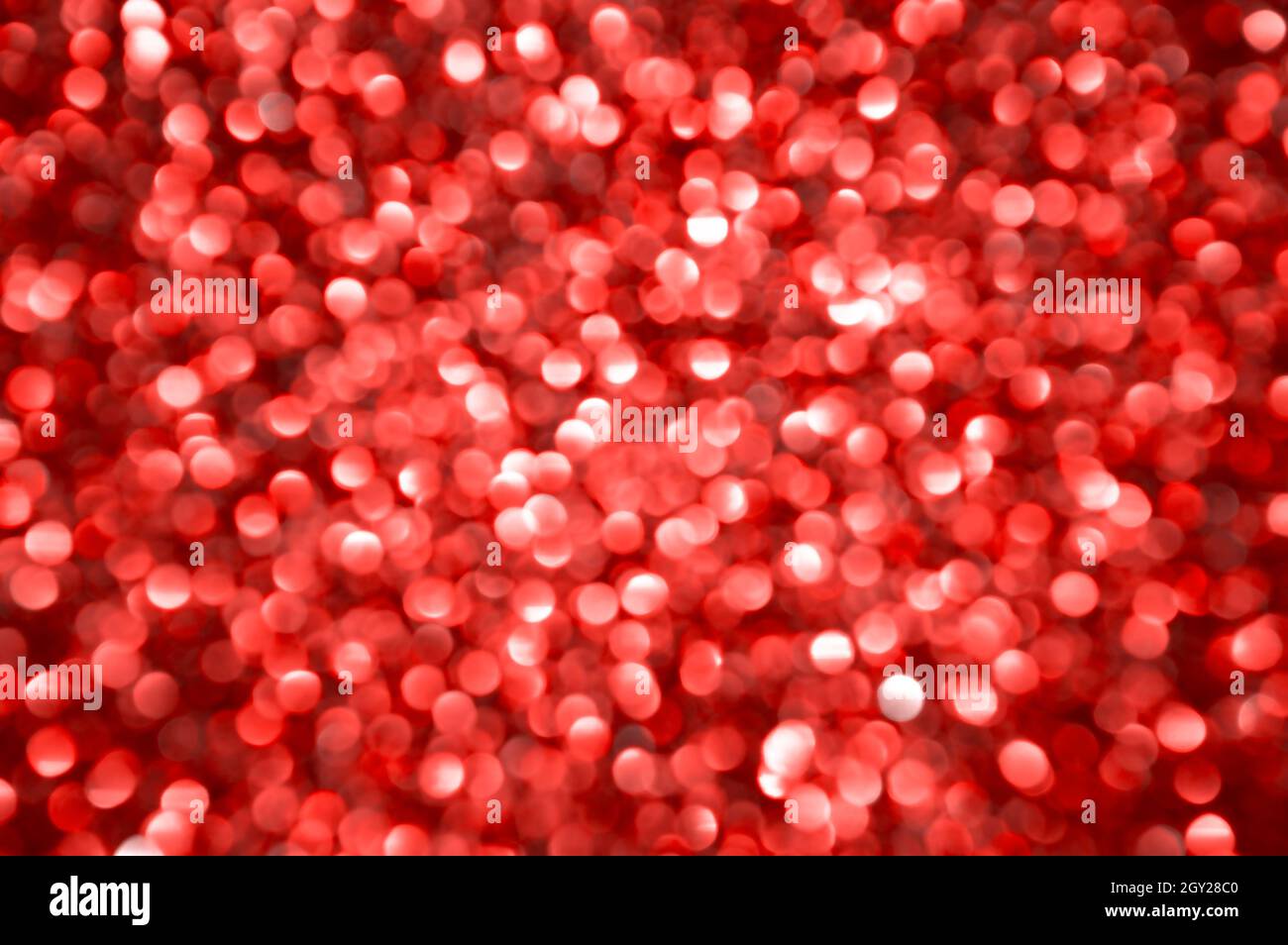 Rote defokussierte Lichter Hintergrund. Abstrakter festlicher Hintergrund Stockfoto