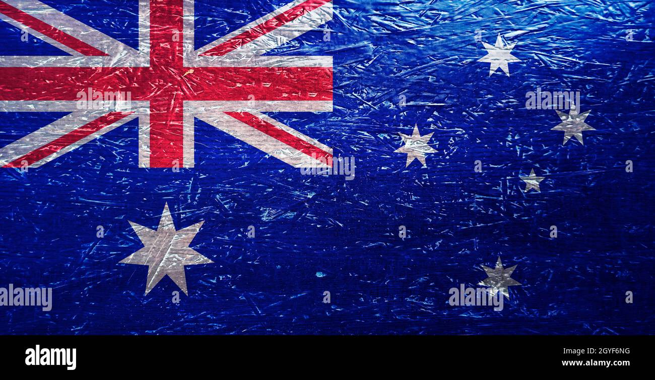 Australische Flagge auf zerknitterter Oberfläche. Australisches Symbol auf zerkratzter Oberfläche. Australische Flagge auf texturiertem Hintergrund. Nationalflagge Australiens. Australien Stockfoto