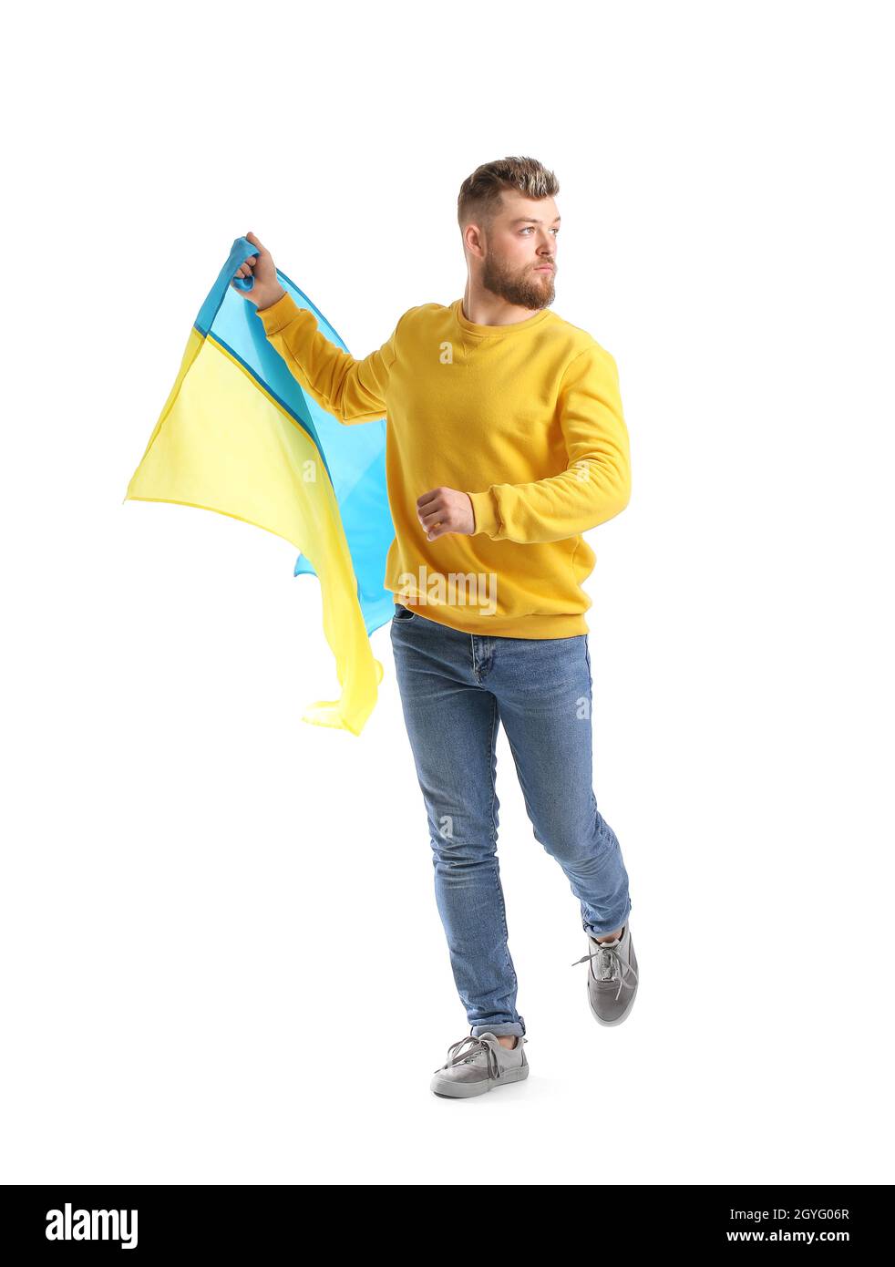 Junger Mann mit ukrainischer Flagge auf weißem Hintergrund Stockfoto