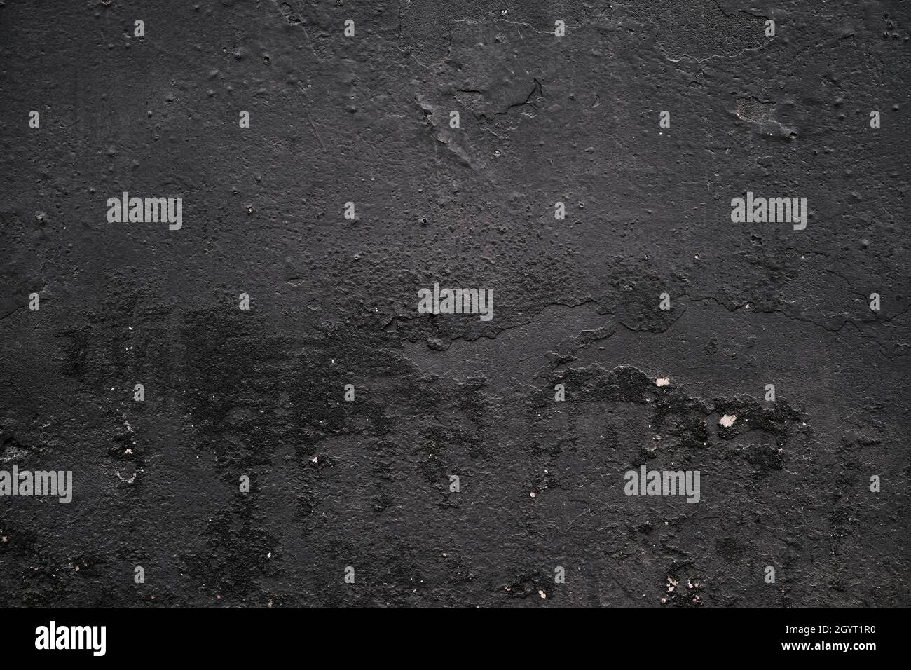 Schwarze kolossierte Gipswand Detail, grunge Hintergrund oder Textur Stockfoto