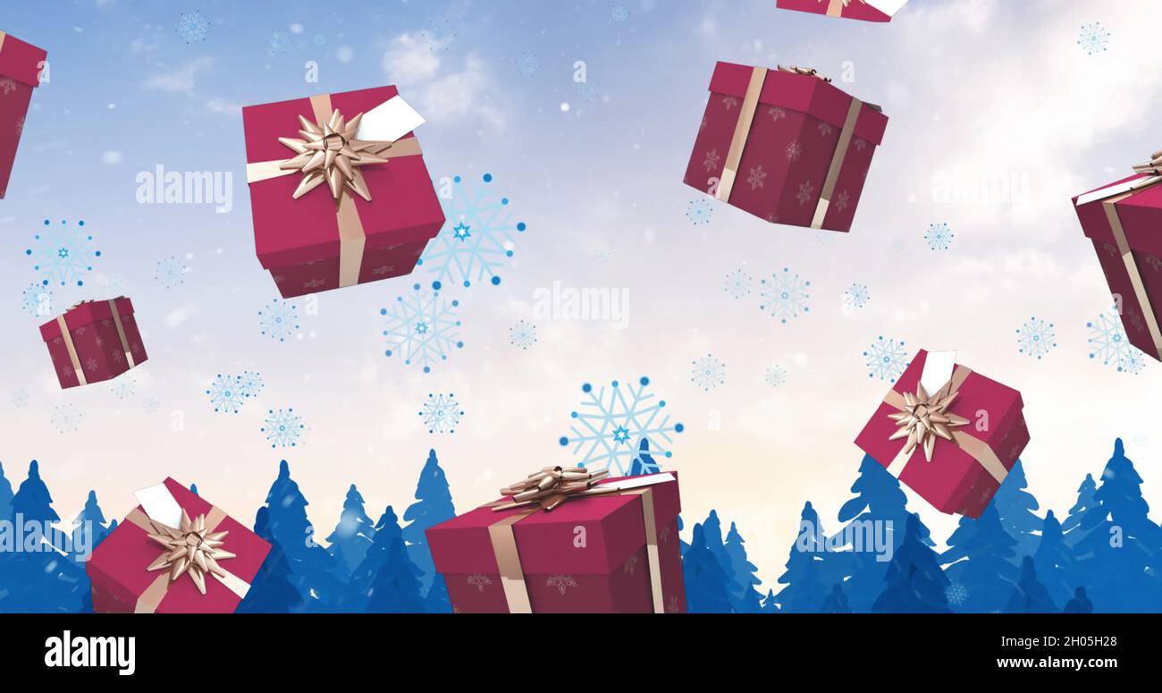 Bild von weihnachtsgeschenken und Schnee fällt über die Winterlandschaft Stockfoto