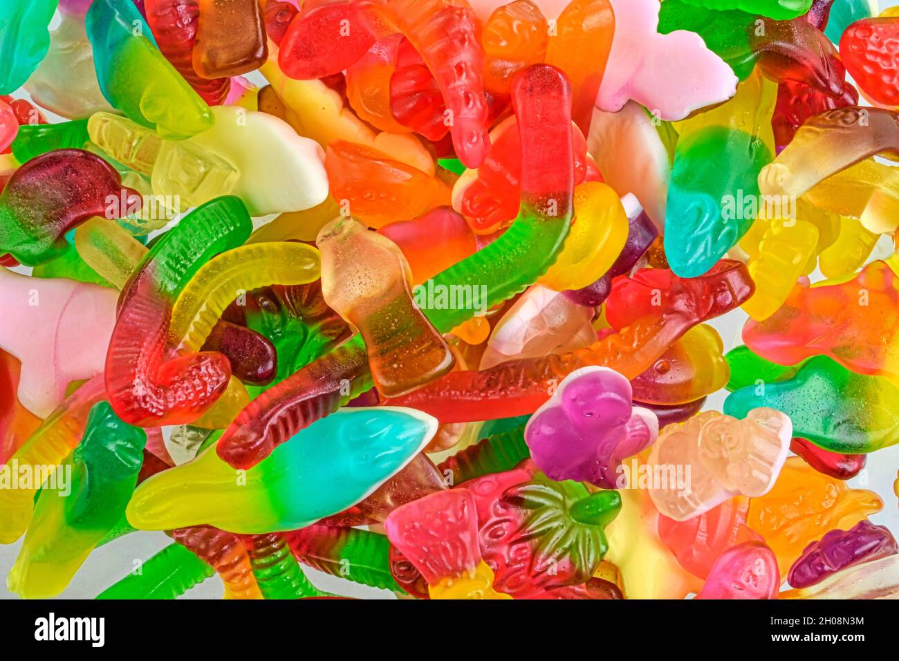 Verschiedene leckere leckere leckere leckere Süßigkeiten. Draufsicht. Obst Gummy Süßigkeiten Hintergrund Stockfoto
