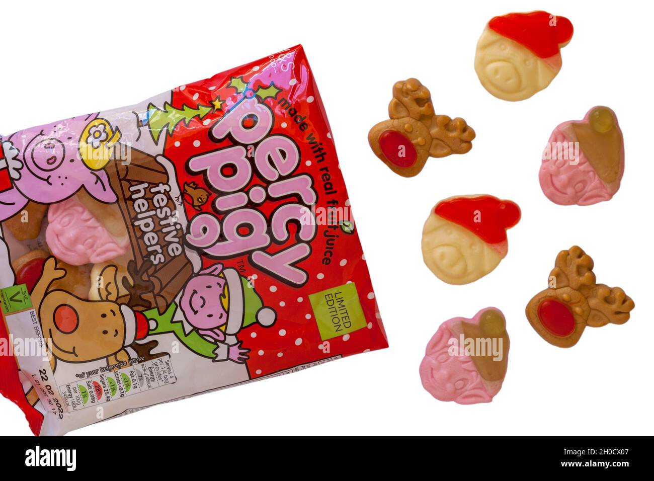 Beutel mit M&S Percy Pig Festliche Helfer Süßigkeiten mit echtem Fruchtsaft geöffnet mit Inhalt verschüttet verschüttet auf weißem Hintergrund - Percy Pig Süßigkeiten Stockfoto