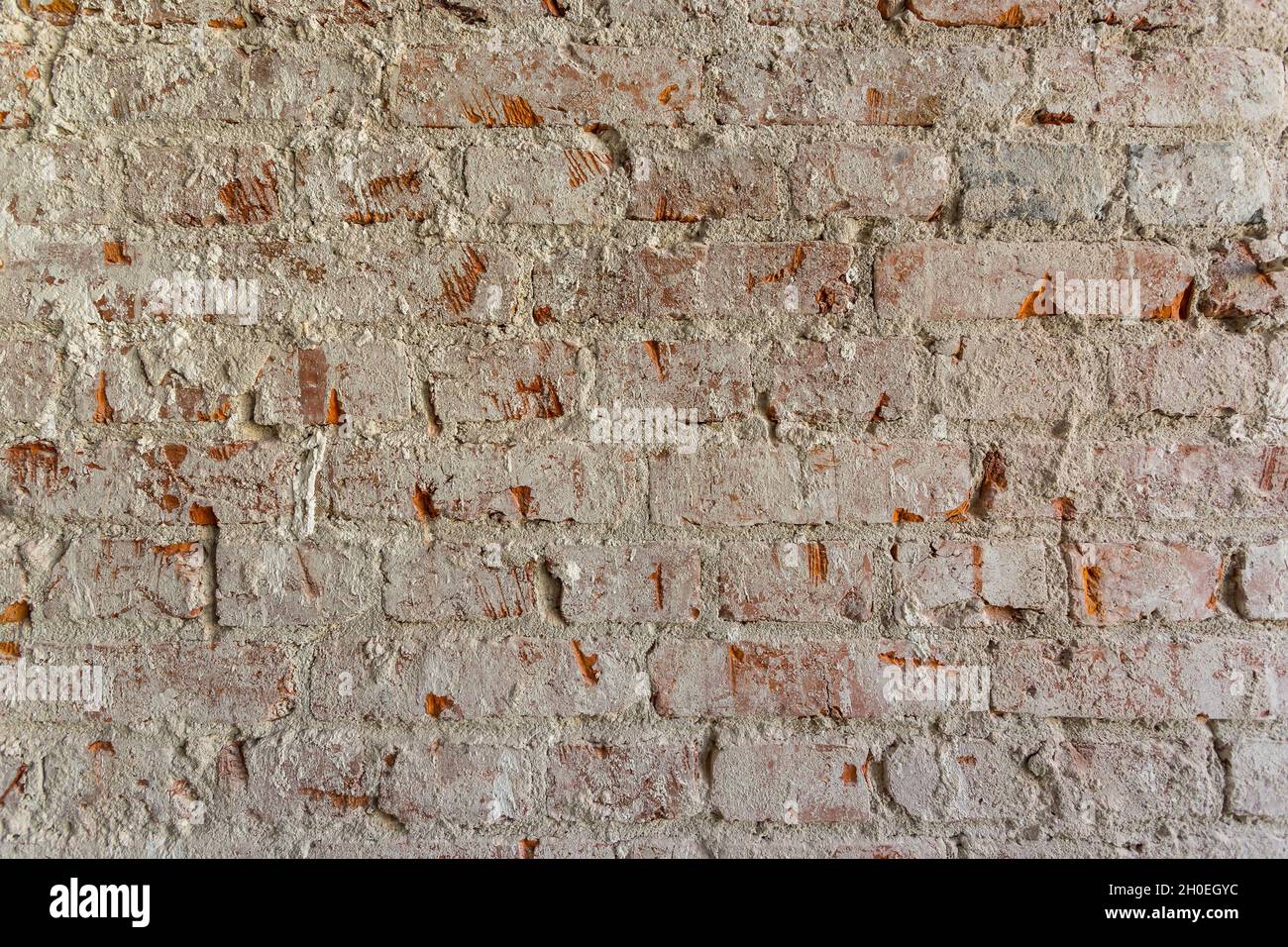 Raue alte orange Backstein Wand Textur Hintergrund Stockfoto