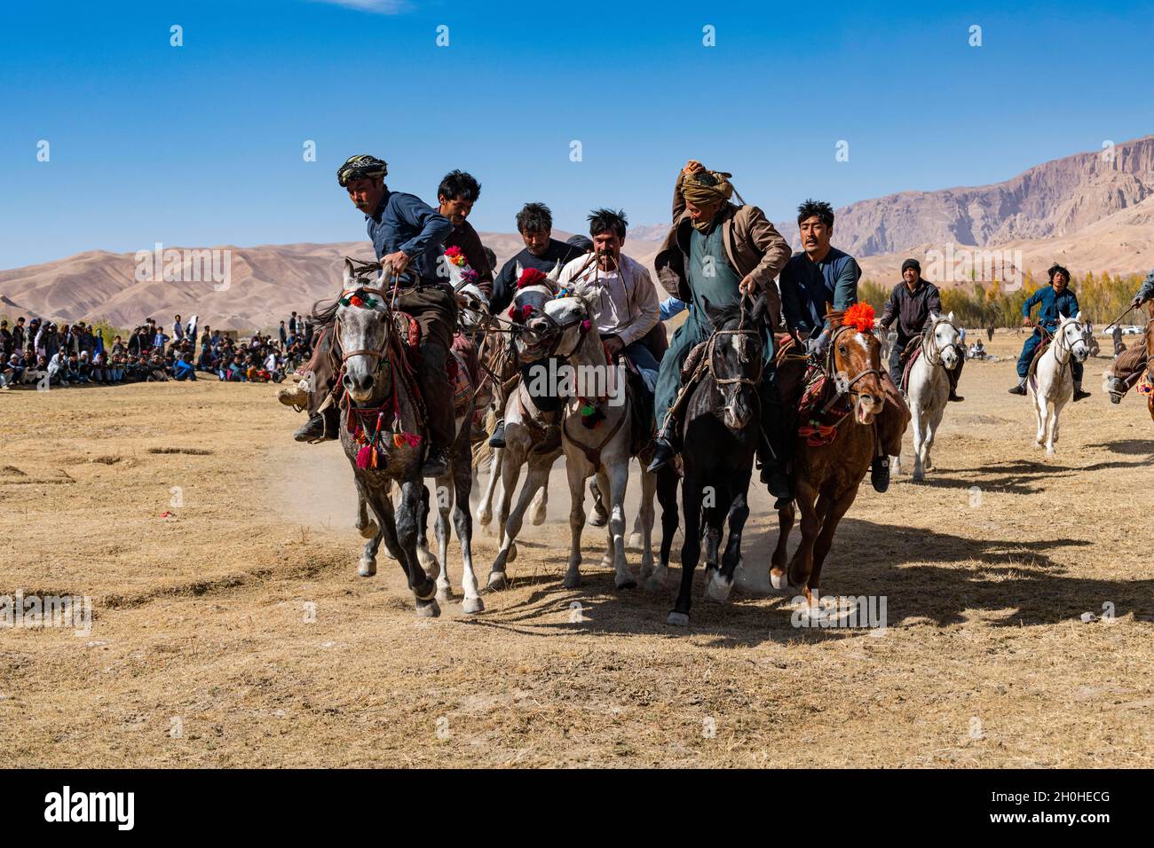 Männer üben ein traditionelles Buzkashi-Spiel, Yaklawang, Afghanistan Stockfoto