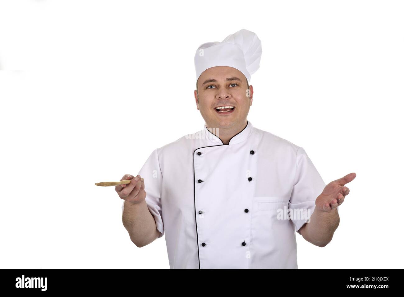 Kochen Sie mit Holzlöffel Stockfoto