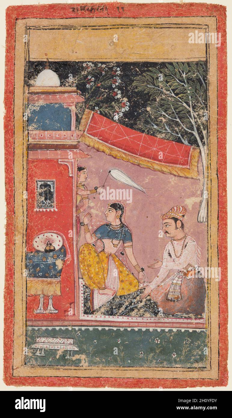 Liebhaber auf einer Terrasse: Ramakali Ramini von Hindol, aus einem Bundi Ragamala, c. 1610. Nordwestindien, Rajasthan, Rajput Königreich Bundi. Gummitemperatur und Gold auf Papier; Seite: 21.3 x 12.4 cm (8 3/8 x 4 7/8 Zoll). Auf einem Blumenteppich vor einem Schlafraum sitzend, versucht ein Adliger, der in Mughal-Kleidung einschließlich Jahangir-Periode Turban und dekorierter Schärpe gekleidet ist, seinen unzufriedensten Gemahl zu entbinden. Die Dame wendet ihr Gesicht vom Mann ab und zeigt, dass seine Appelle ignoriert wurden. Der schwarze Himmel zeigt an, dass ihr Streit mitten in der Nacht stattfindet. Stockfoto