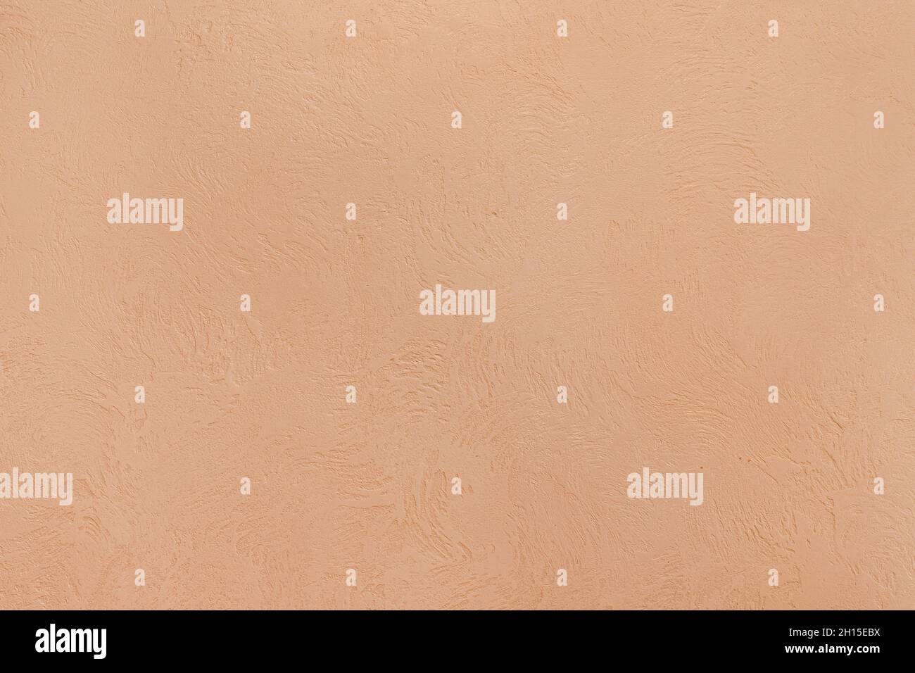 Sandfarbe helle Wandoberfläche mit abstraktem Muster Textur Hintergrund. Stockfoto