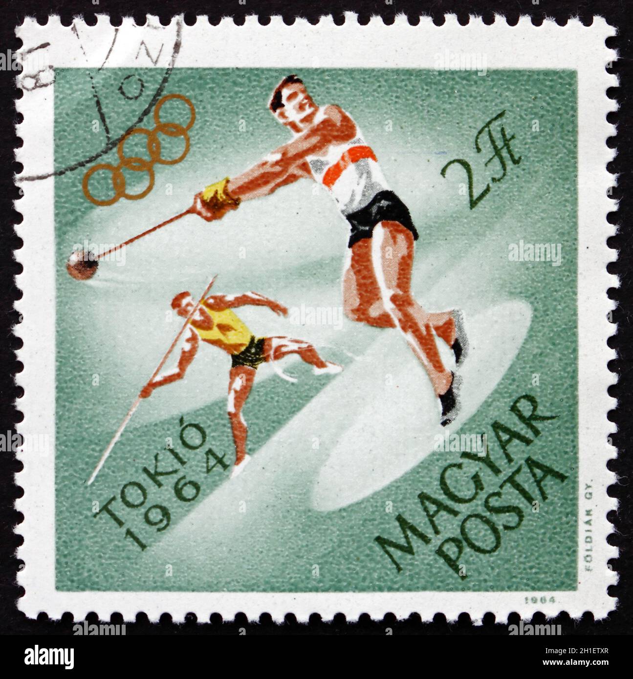 UNGARN - UM 1964: Eine in Ungarn gedruckte Briefmarke zeigt Hammerwurf und Javelin, 18. Olympische Spiele, Tokio, um 1964 Stockfoto