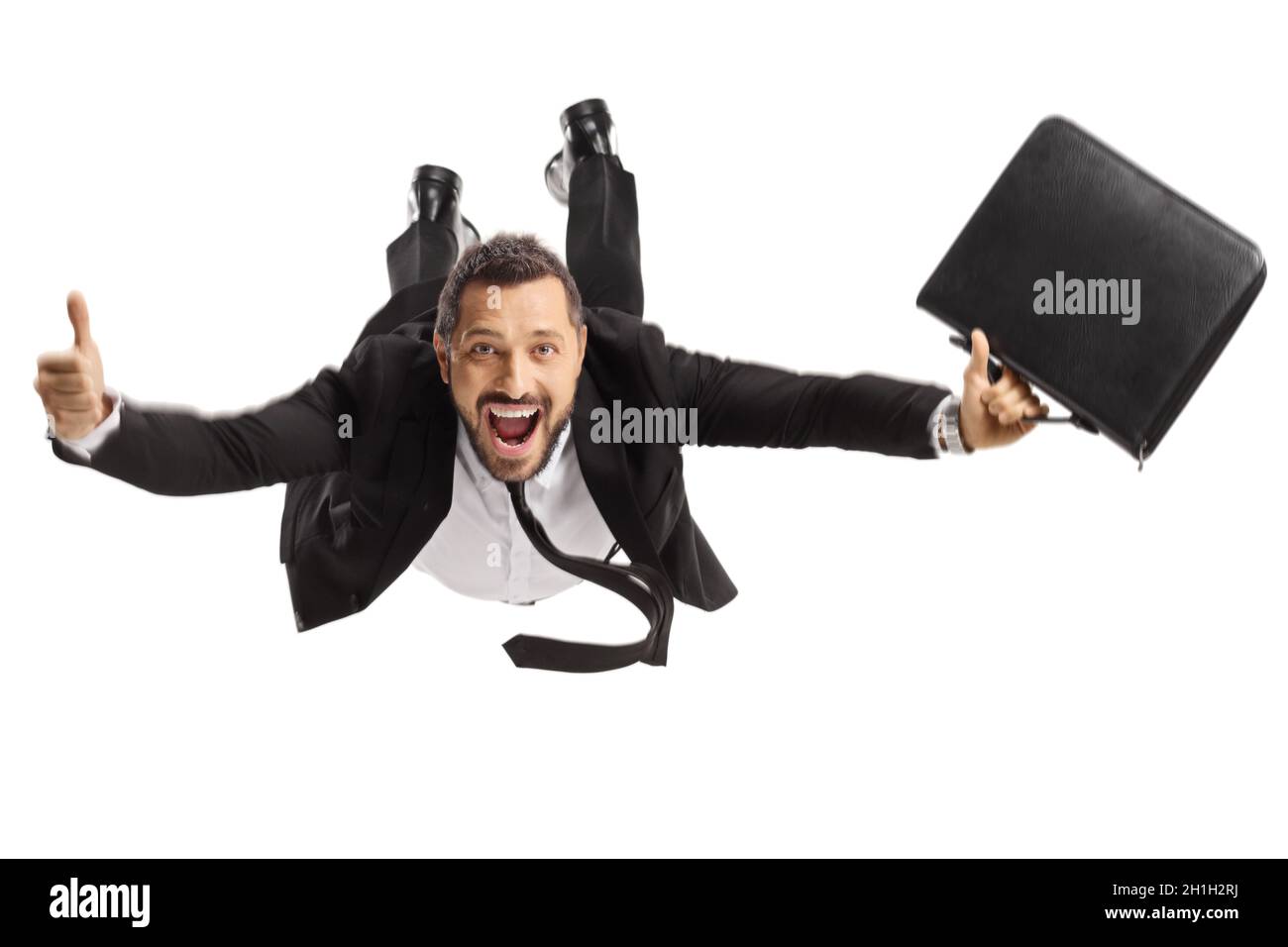 Geschäftsmann-Superheld mit einer Aktentasche, die fliegt und die Daumen nach oben auf weißem Hintergrund stikuliert Stockfoto