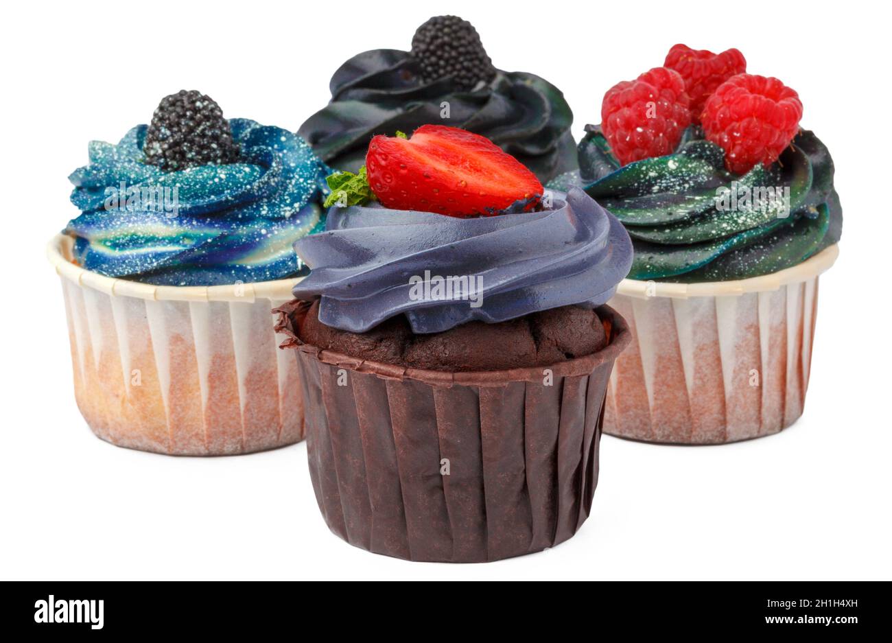 Gruppe von Cupcakes mit farbigen Belag isoliert auf weißem Hintergrund Stockfoto