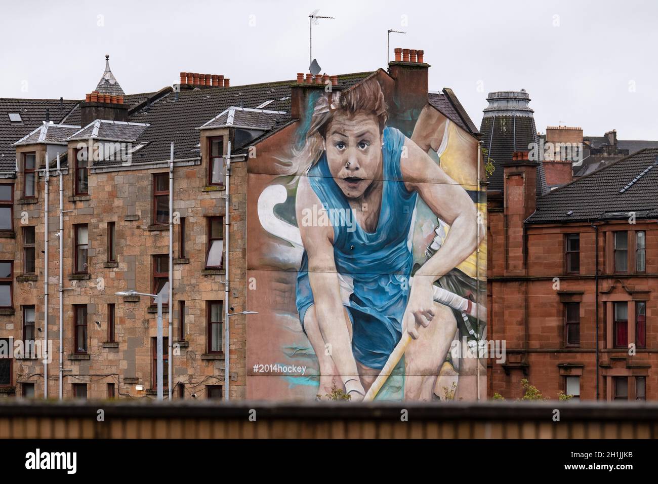 Partick Tenements, mit Commonwealth Games 2014 Wandbild, Glasgow, Schottland, Großbritannien Stockfoto