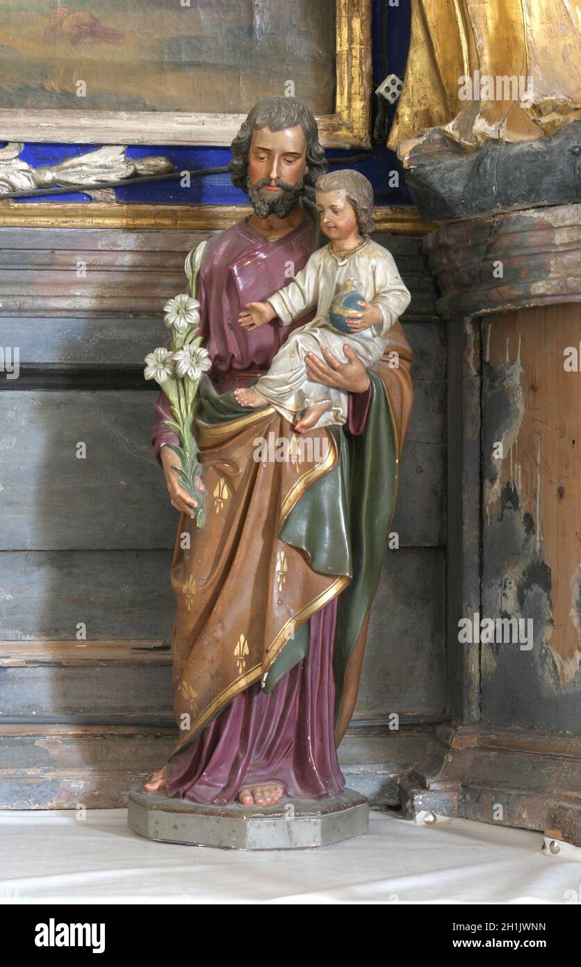 Saint-Joseph Holding Baby Jesus Stockfoto