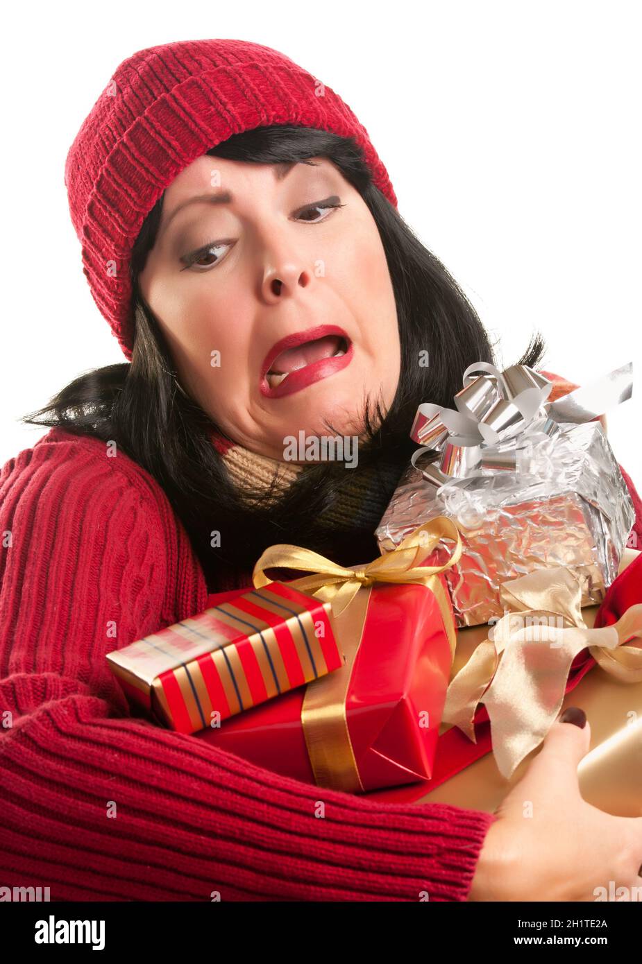 Attraktive Frau tastete mit ihrer Weihnachtsgeschenke, Isolated on White Background. Stockfoto
