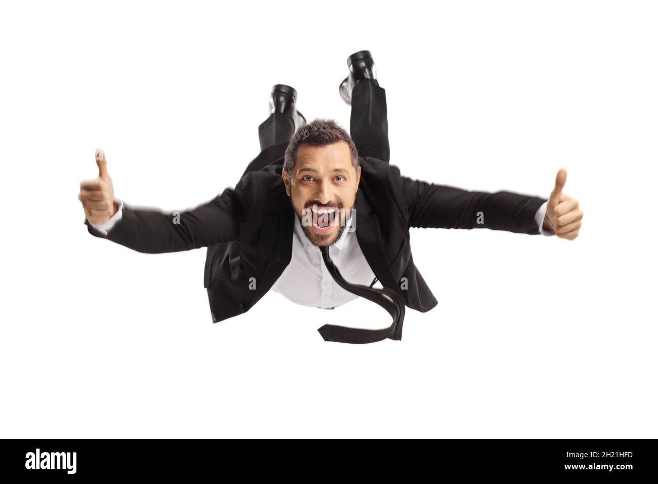 Geschäftsmann fliegt und gestikelt Daumen nach oben isoliert auf weißem Hintergrund Stockfoto