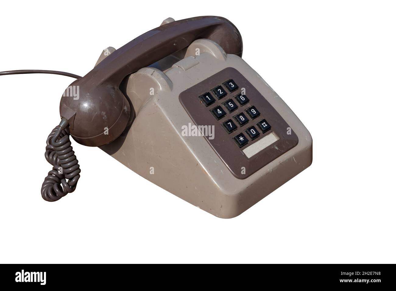 Ein altes und dreckiges Telefon mit Nummernblock Stockfoto