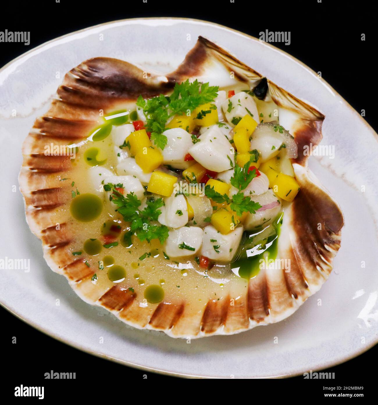 Jakobsmuschel Ceviche peruanische, lateinamerikanische traditionelle Meeresfrüchte-Gerichte Stockfoto