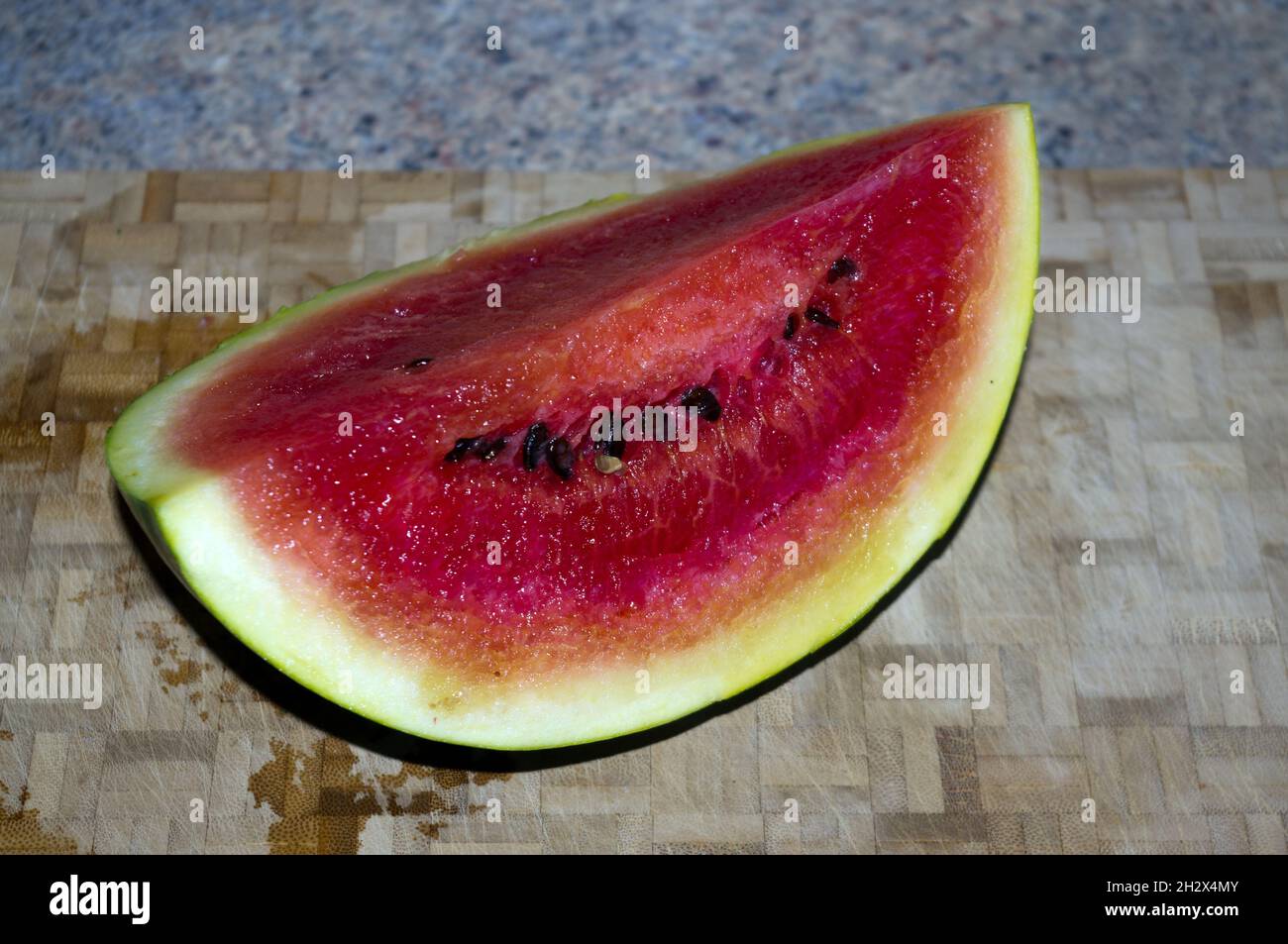 Viertel einer reifen Melone Stockfoto