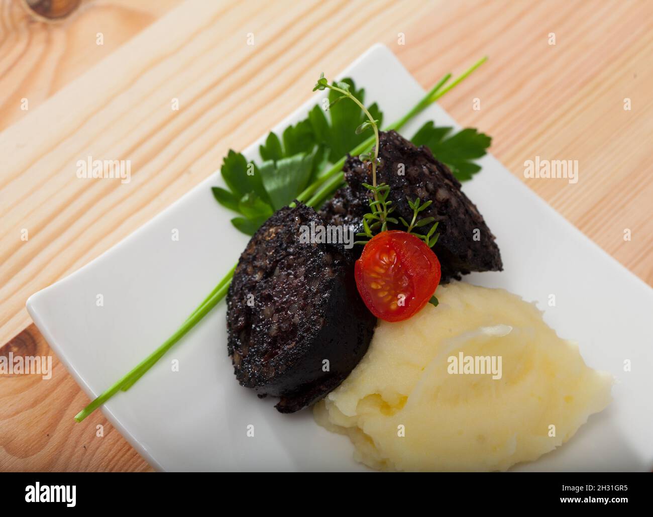 Morcilla Blutwurst mit Reis Stockfoto