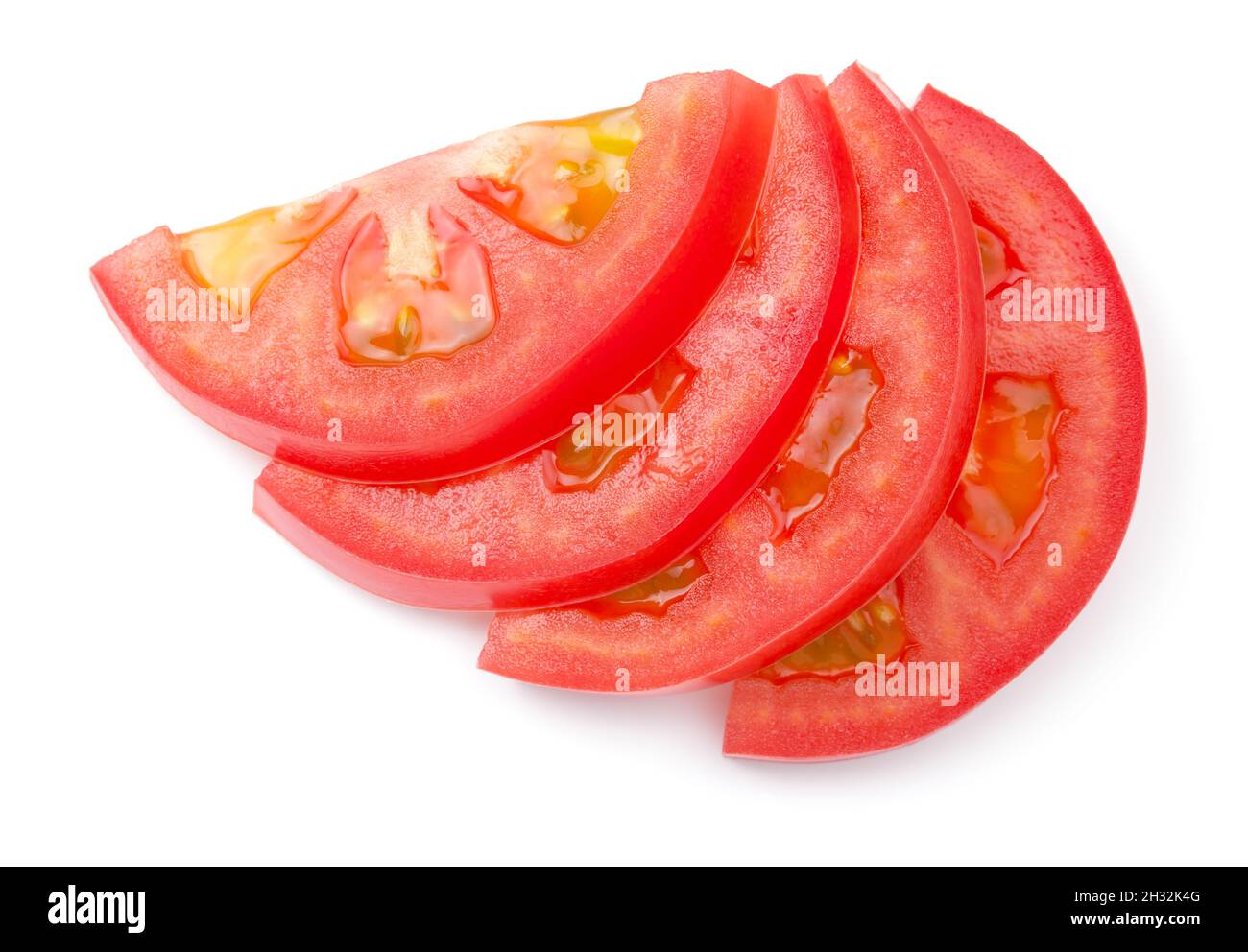 Tomatenscheiben isoliert auf weißem Hintergrund. Draufsicht Stockfoto
