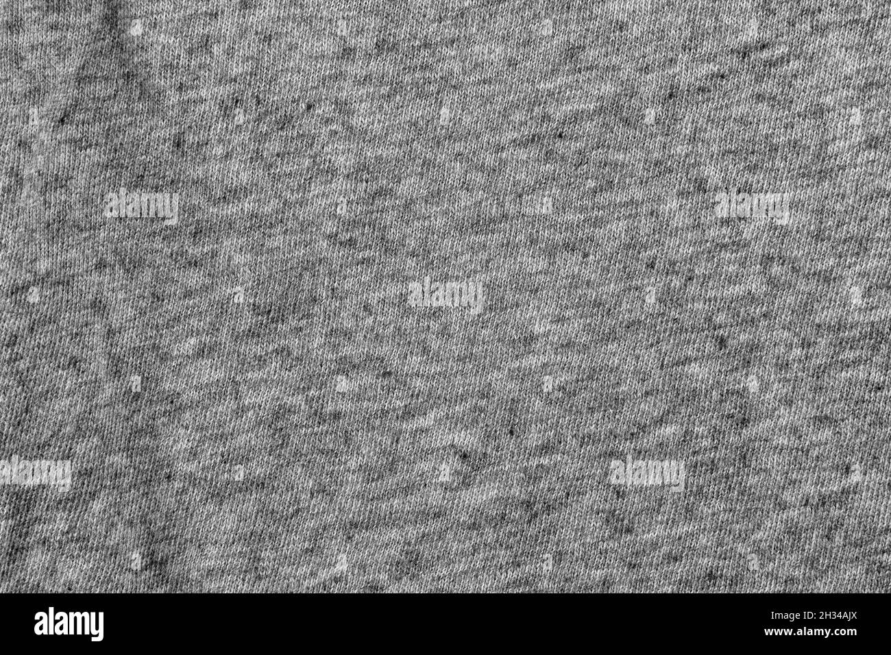 Zerknitterte graue Stoffstruktur mit natürlichem Muster. Abstrakter Hintergrund Stockfoto