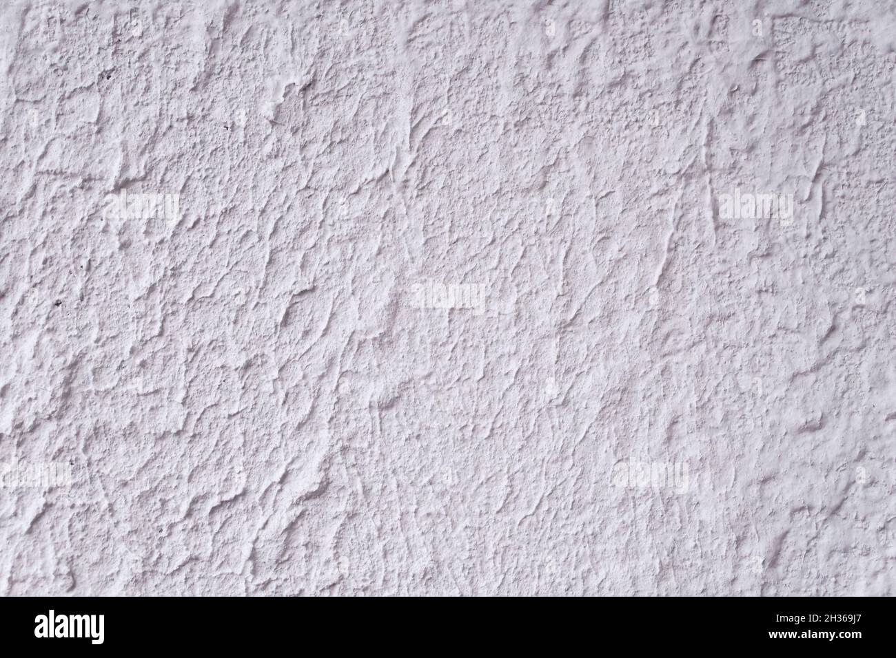 Struktur aus strukturiertem weißem dekorativem Gips als Hintergrund. Stockfoto
