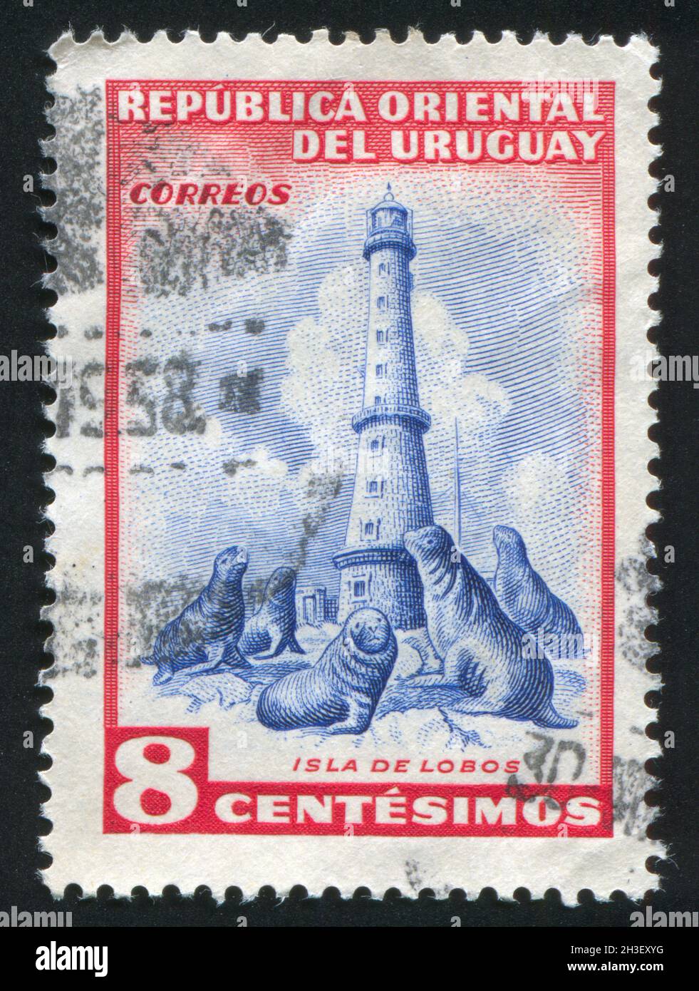 URUGUAY - UM 1954: Briefmarke gedruckt von Uruguay, zeigt Robben-Insel (Südsee-Löwen) und Leuchtturm, um 1954 Stockfoto