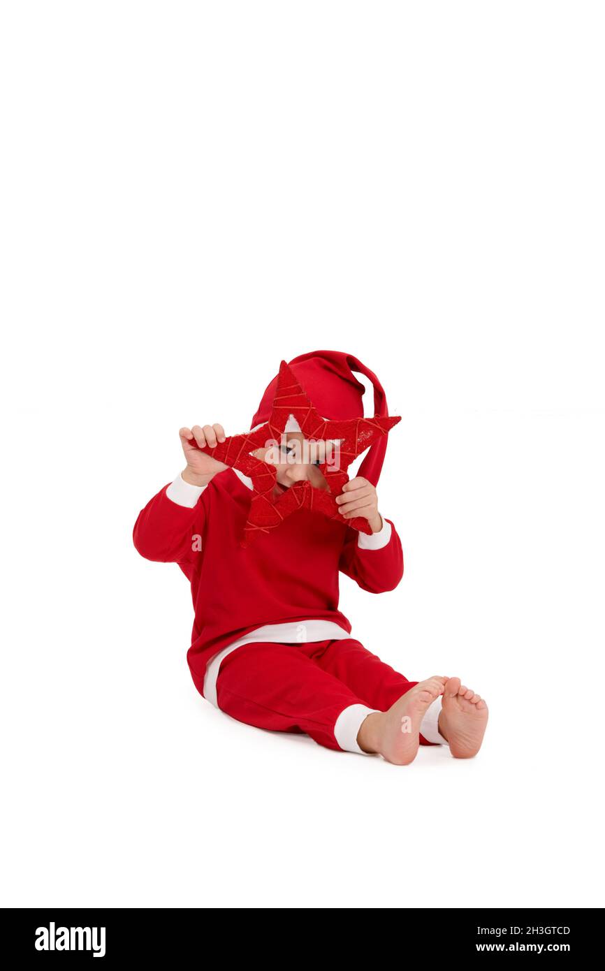 Nettes Kind posiert mit weihnachtsstern Stockfoto