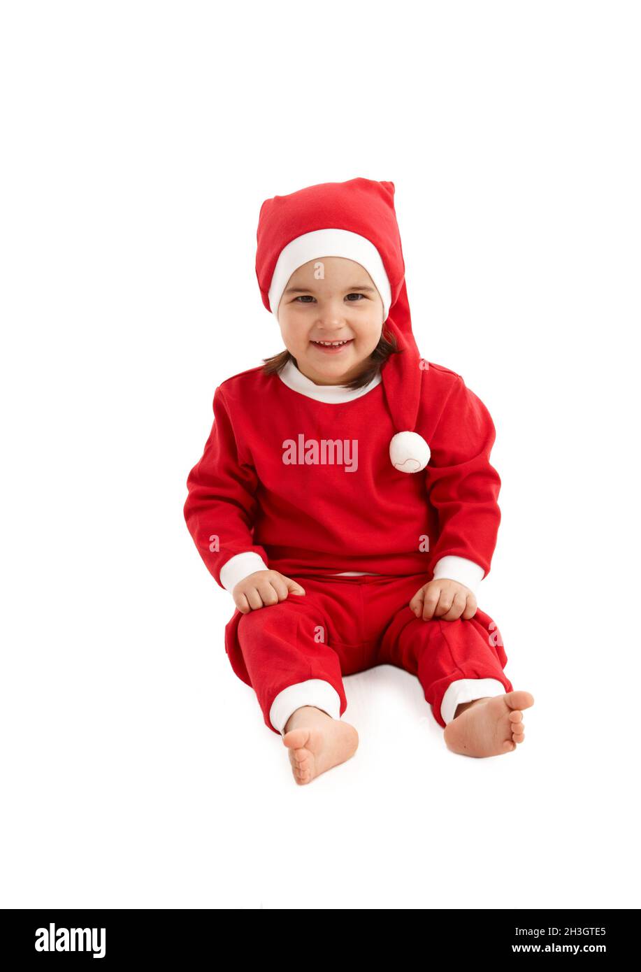 Weihnachtsmann Kostüm auf kleines Kind Stockfoto