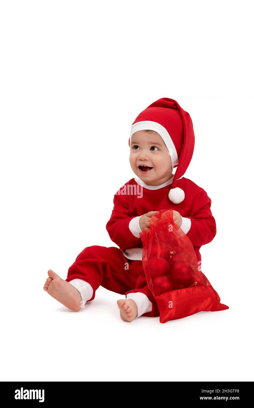 Glücklicher kleiner Junge im weihnachtsmann Kostüm Stockfoto