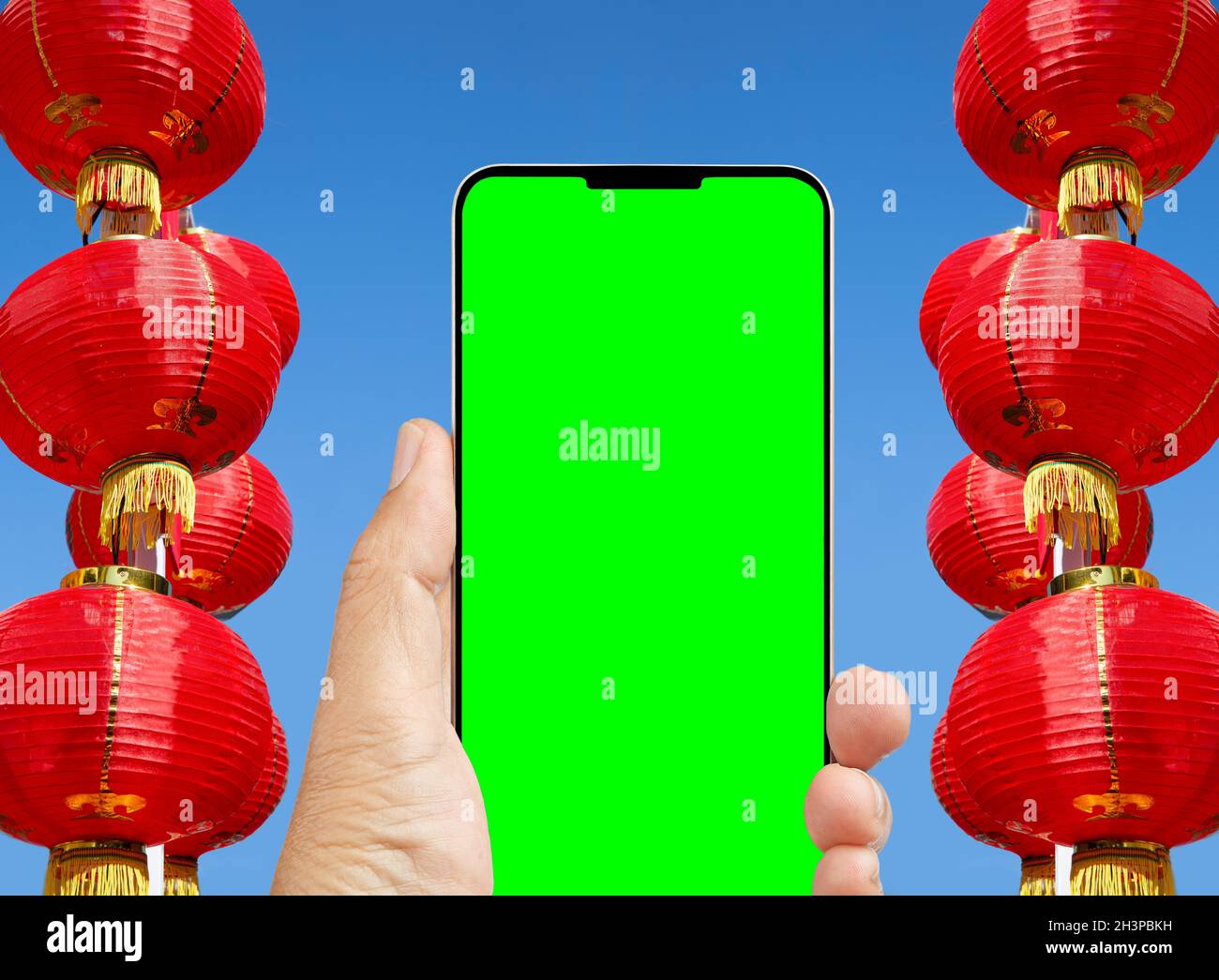 Der Yuan digital auf Handy im chinesischen Mond Neujahr, Online-Shopping, Chroma-Key-Bildschirm. Stockfoto