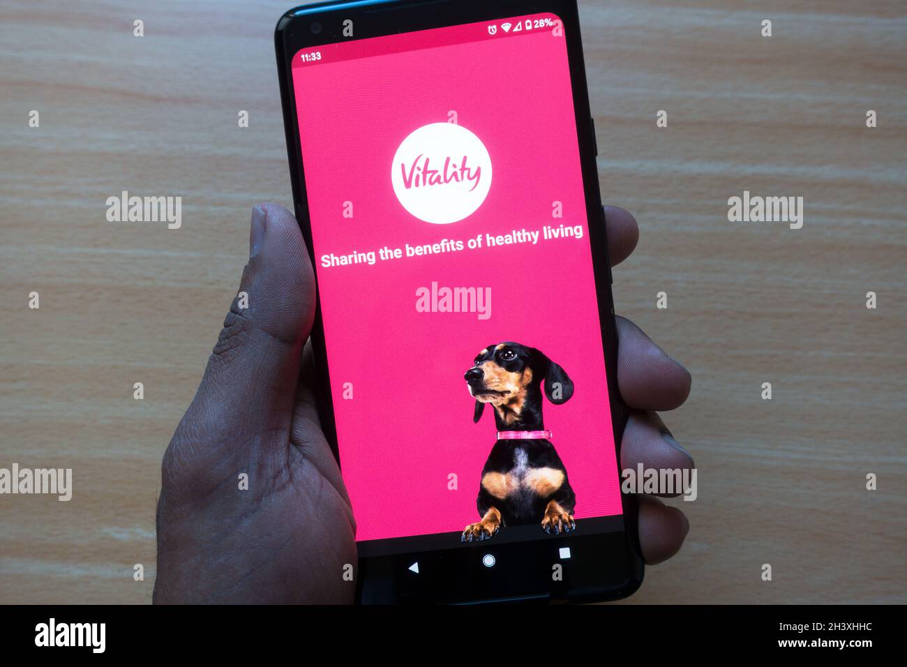 Vitality Krankenversicherung App auf dem Handy, um gesunde Lebensgewohnheiten zu verfolgen und zu belohnen durch Kaffee, Kino Gutscheine Stockfoto