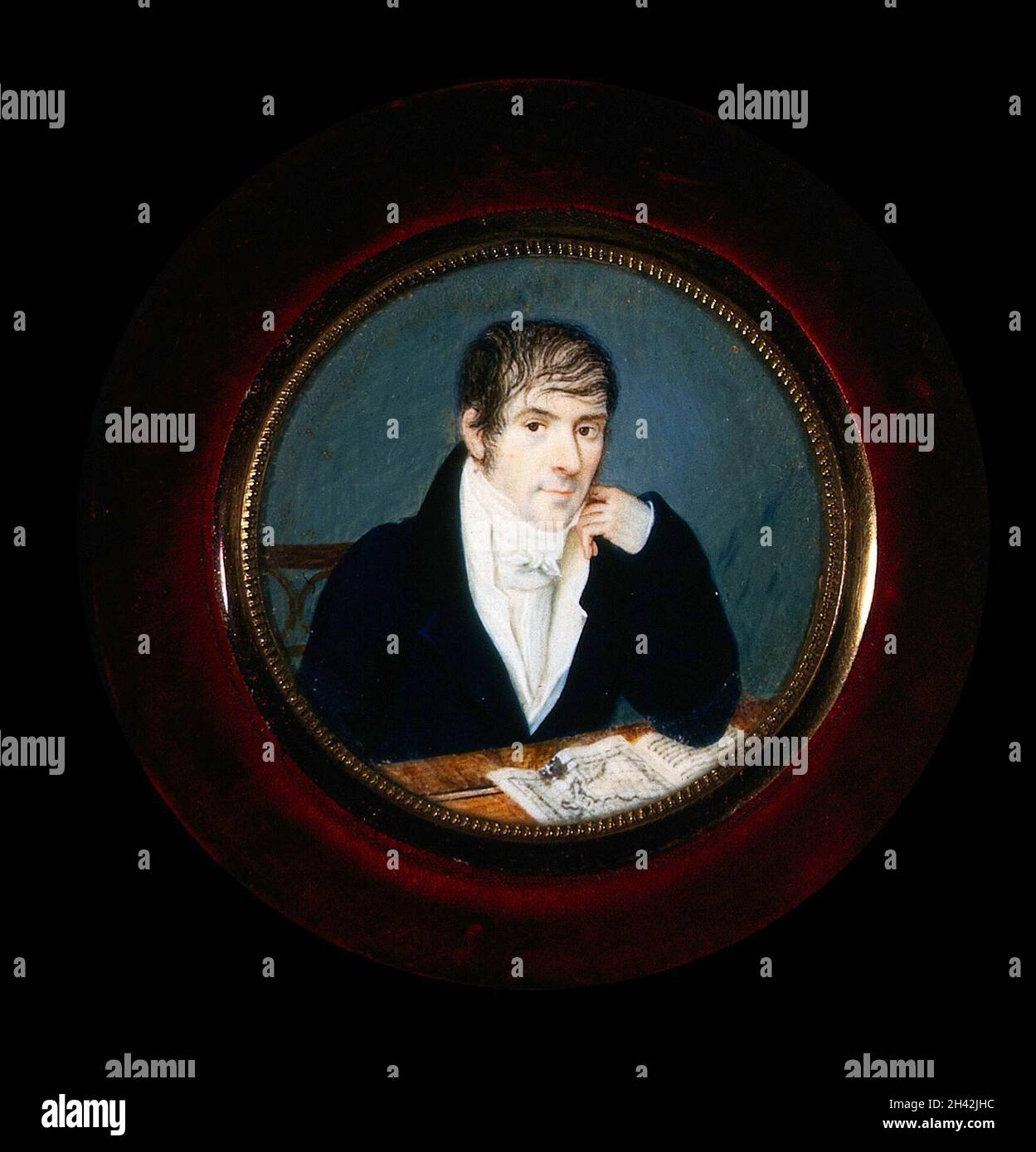 Ein Mann saß an seinem Schreibtisch mit einer Karte von Italien vor ihm. Gouache Malerei, ca. 1800. Stockfoto