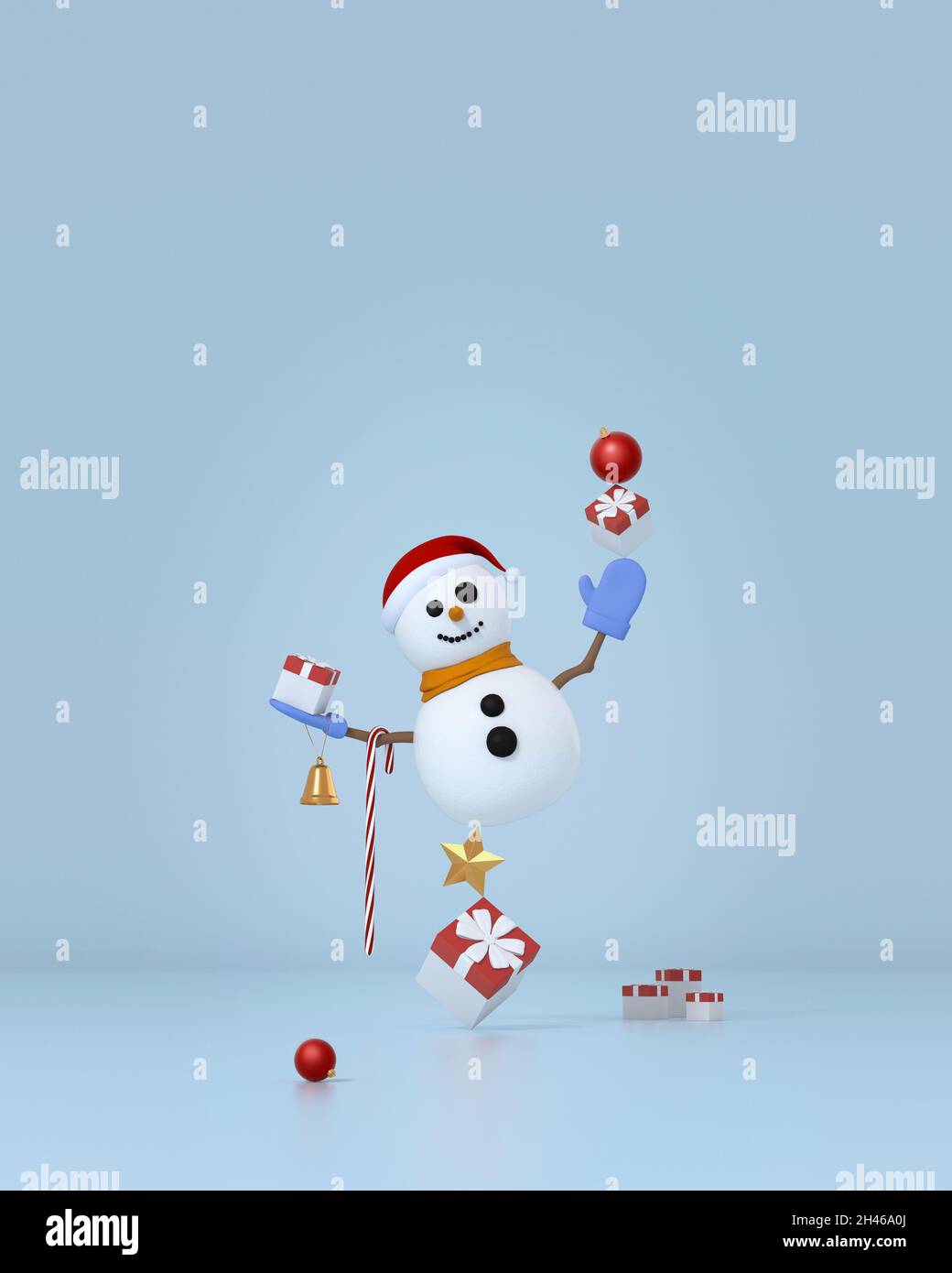 Schneemann mit Weihnachtsschmuck balanciert auf Geschenkboxen und Stern. Stockfoto