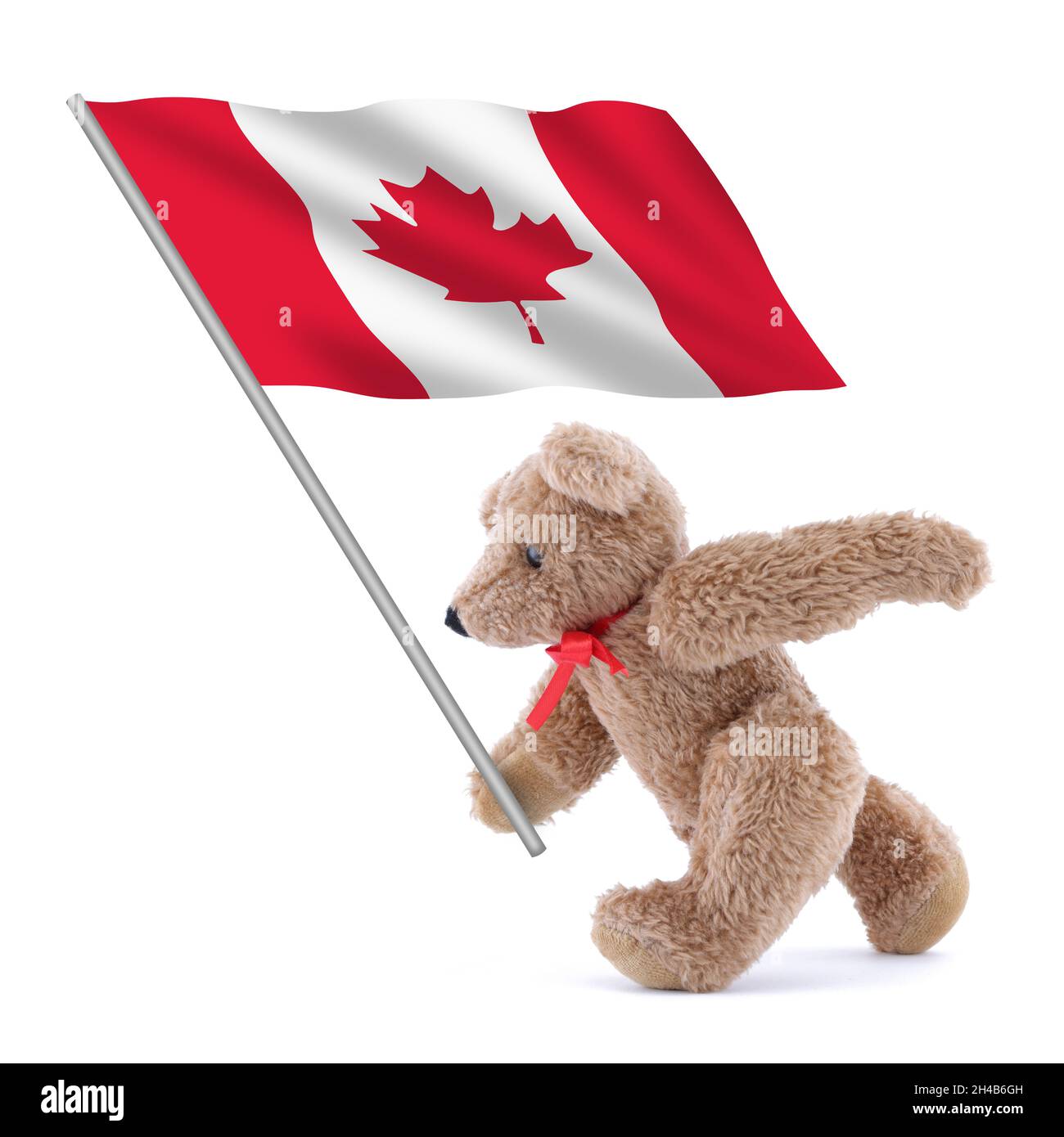Die kanadische Flagge wird von einem niedlichen Teddybären getragen Stockfoto