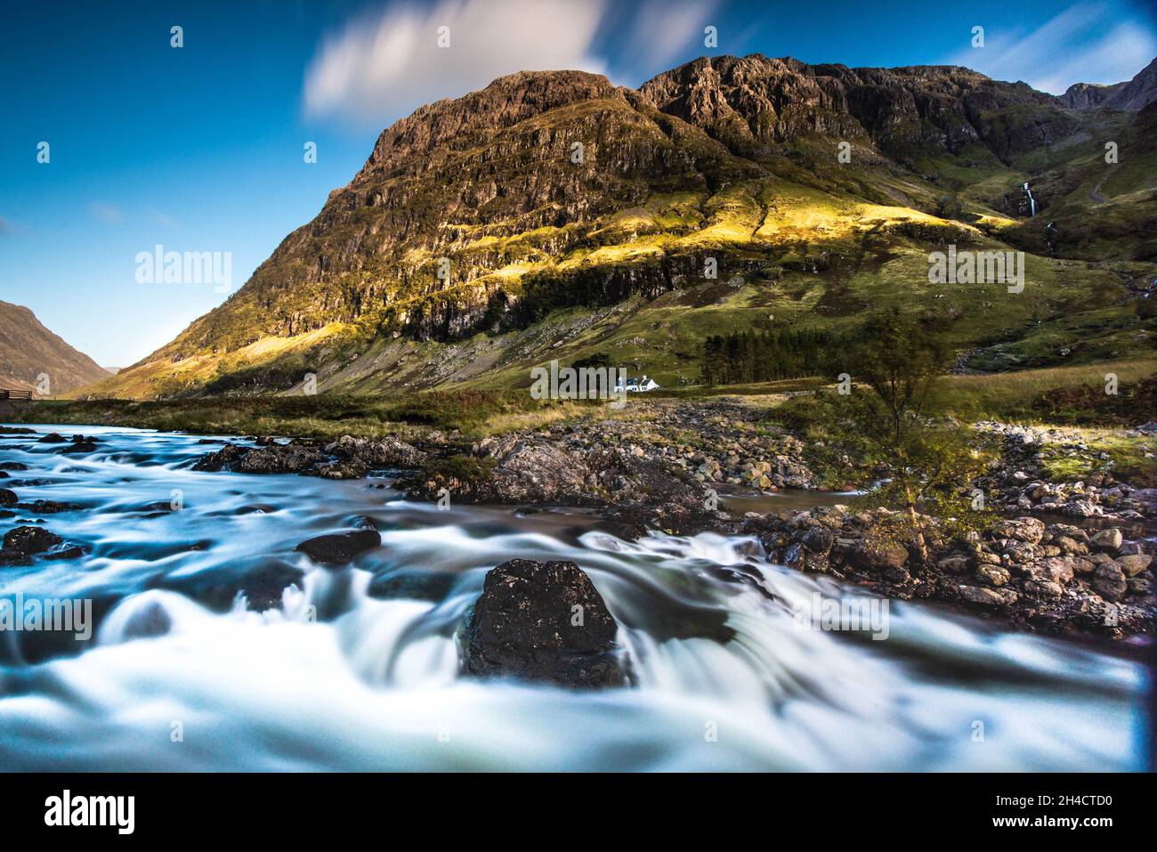 Spätes Licht auf die Berge in Glencoe, Schottland Stockfoto