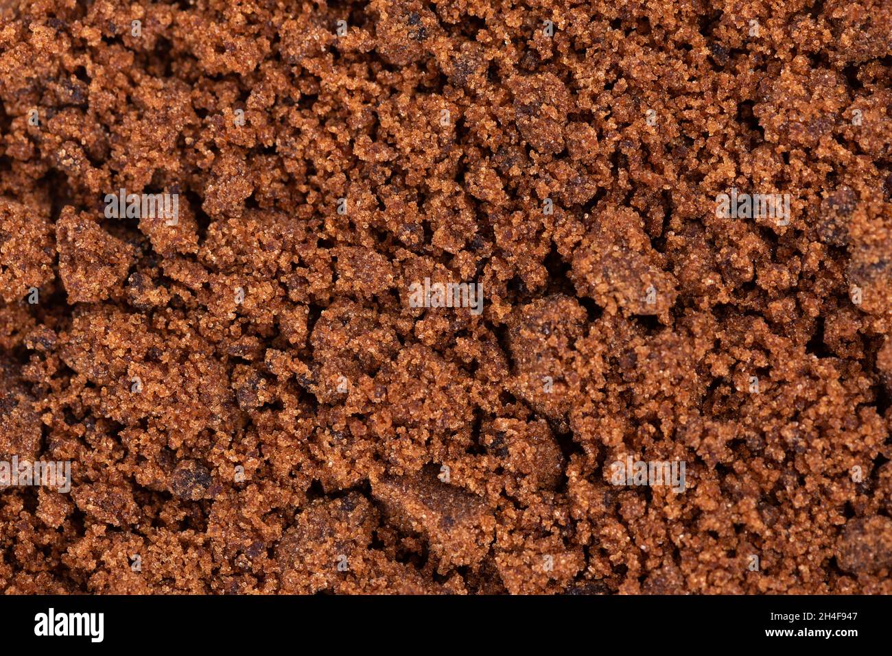 Muscovado Zucker Hintergrund. Barbados Zucker, Khandsari oder khand. Draufsicht. Stockfoto