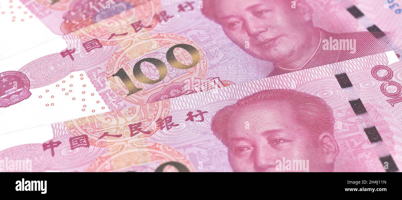 Chinesischer Yuan Renminbi Rechnung Banknoten Hintergrund. Mao-Präsident Porträt über die chinesische Papierwährung 100, Nahaufnahme. Banken und Finanzen Stockfoto