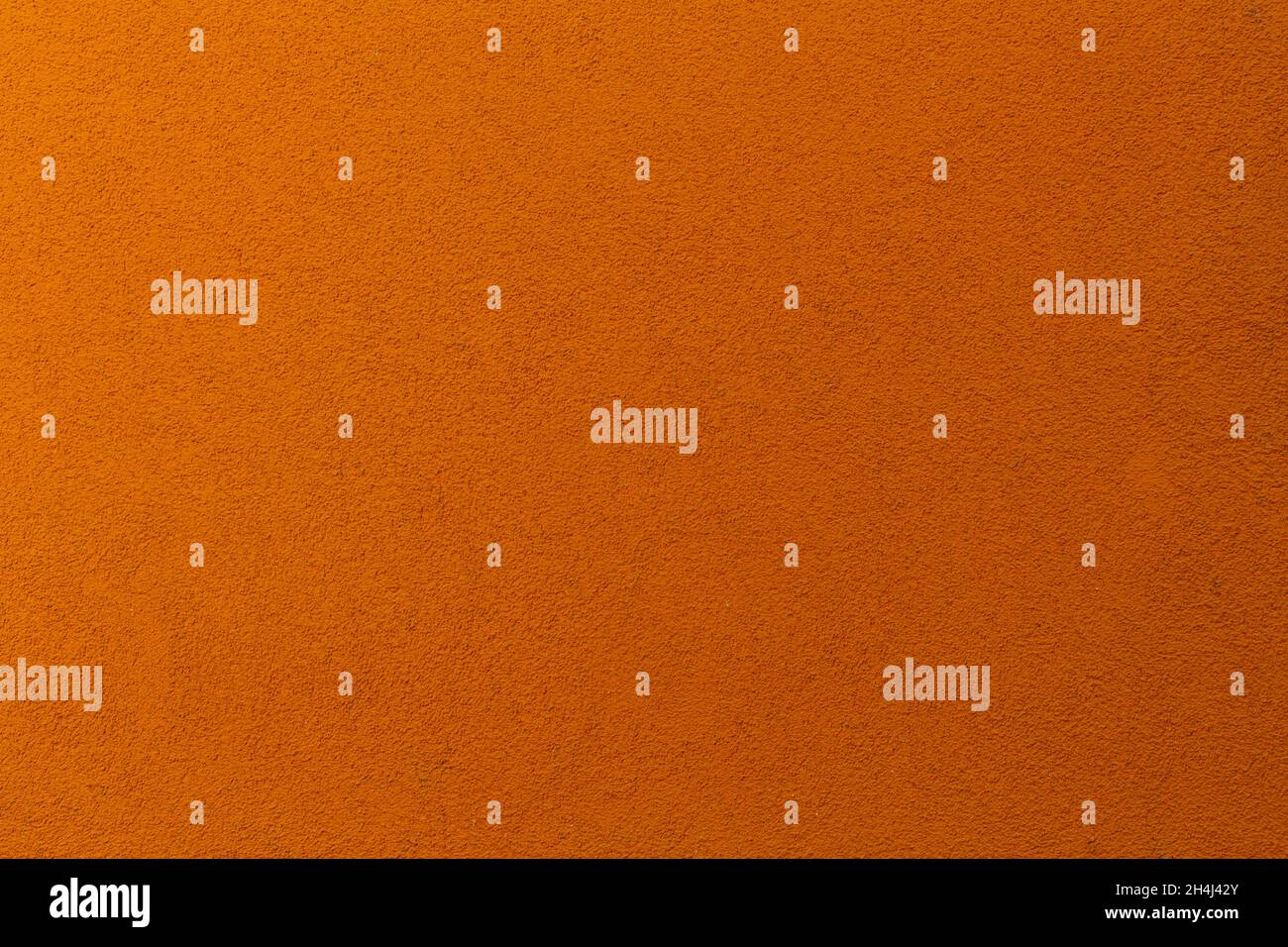 Orangefarbener Hintergrund mit Wandtextur Stockfoto