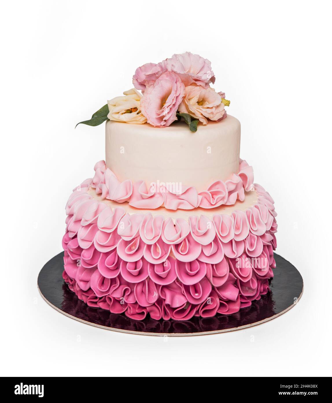 Rosa Kuchen mit Blume isoliert auf weißem Hintergrund Stockfoto