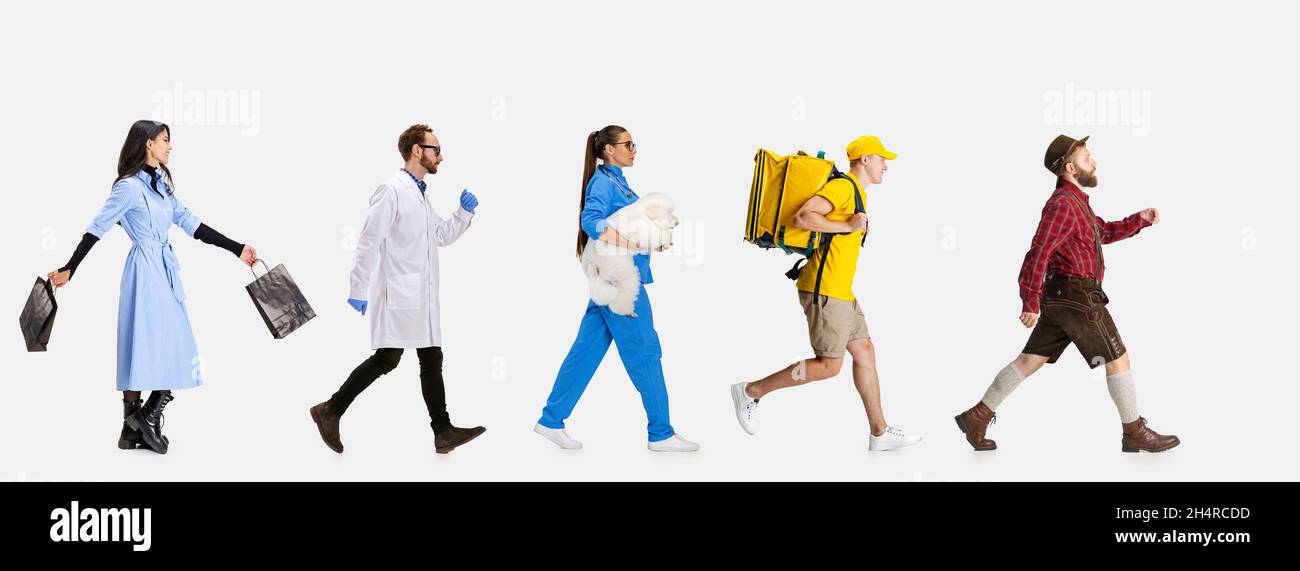 Gruppe von Geschlechtern gemischte Menschen mit verschiedenen Berufen, Arbeitsplätze, die vor sich gehen isoliert auf weißem Studio Hintergrund. Stockfoto Gruppe von Geschlechtern gemischte Menschen mit verschiedenen Berufen, Arbeitsplätze, die vor sich gehen isoliert auf weißem Studio Hintergrund. Stockfoto