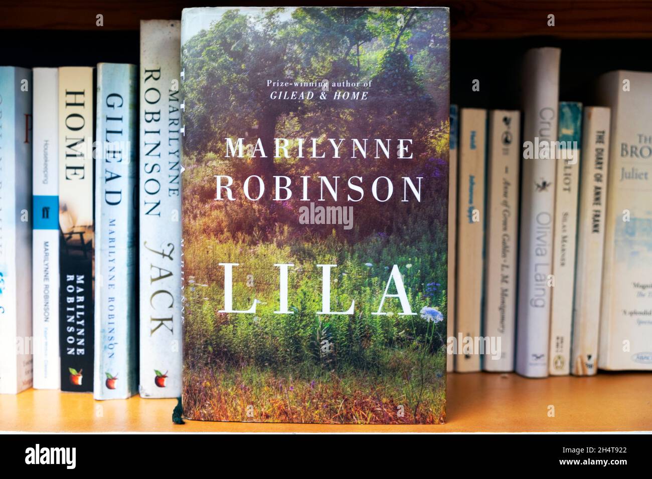 Buchtitel Home, Gilead, Jack und Lila das Buchcover umfasst Romane im Bücherregal der preisgekrönten amerikanischen Autorin Marilynne Robinson KATHY DEWITT Stockfoto