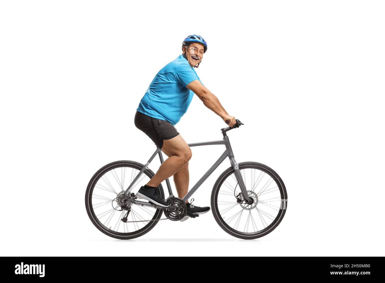 Glücklich reifen männlichen Radfahrer Reiten ein Rennrad isoliert auf weißem Hintergrund Stockfoto