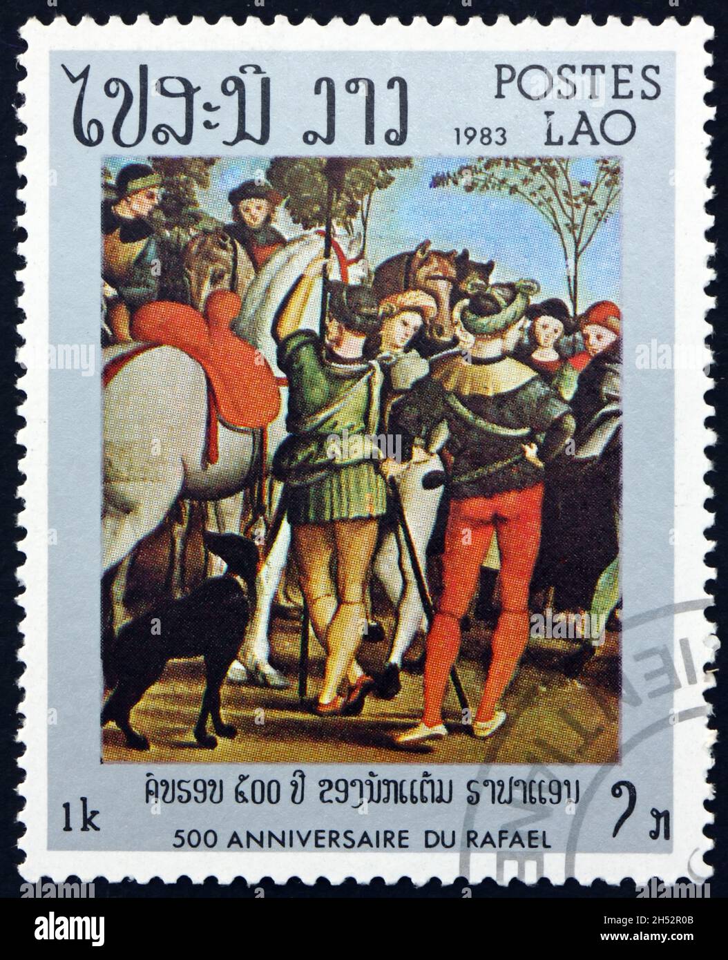LAOS - UM 1983: Eine in Laos gedruckte Briefmarke zeigt die Anbetung der Könige, Vatikan, Florenz, Gemälde von Raphael, um 1983 Stockfoto