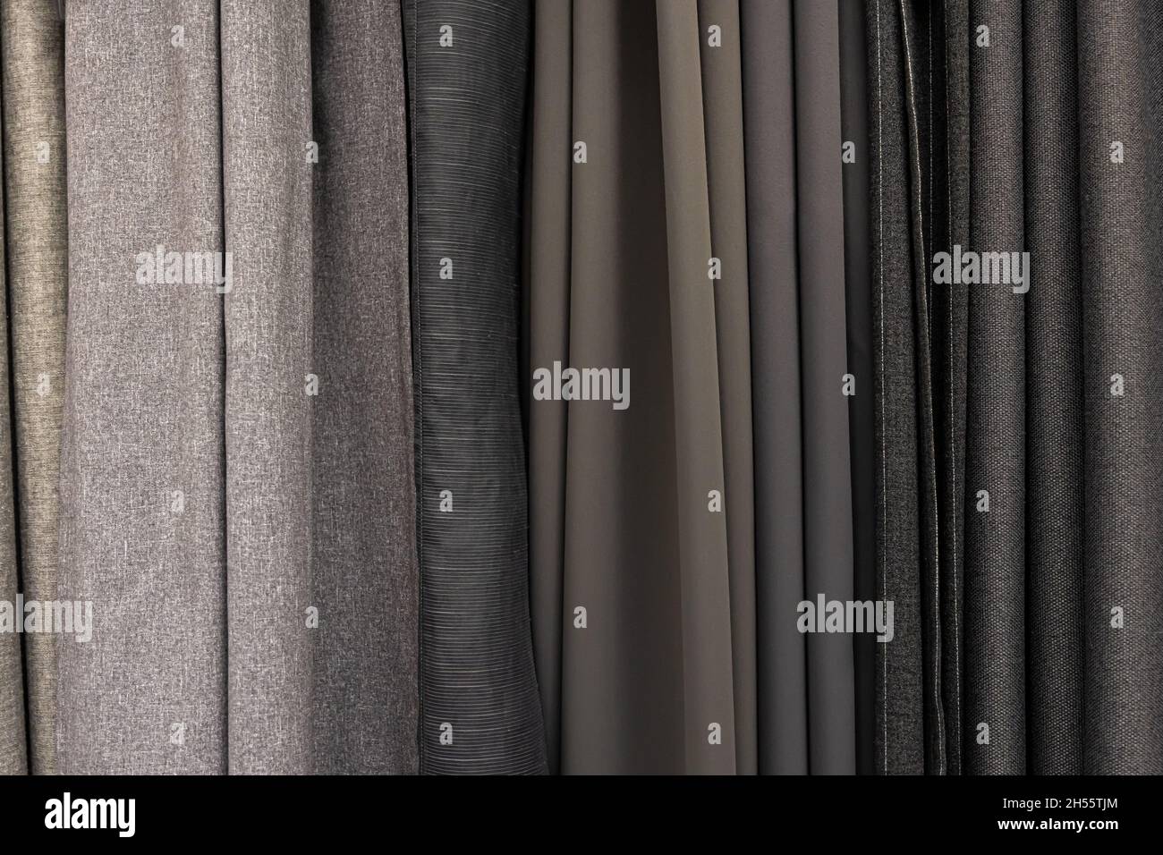 Set aus grauen, dichten Stoffen mit einheitlicher Textur. Stockfoto