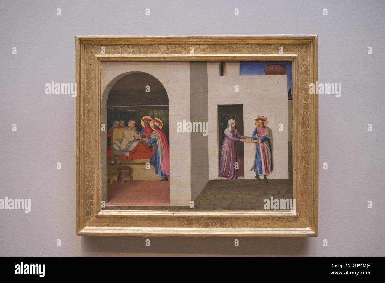 Ein Tempera-Gemälde mit dem Titel The Healing of Palladi von Saint Cosmas und Saint Damian von der italienischen Künstlerin Fra Angelico. In der National Gallery of Art i Stockfoto