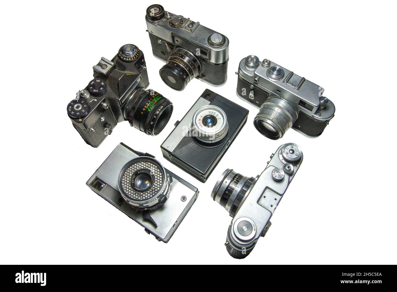 Alte Filmkameras verschiedener Modelle auf weißem Hintergrund isoliert. Stockfoto