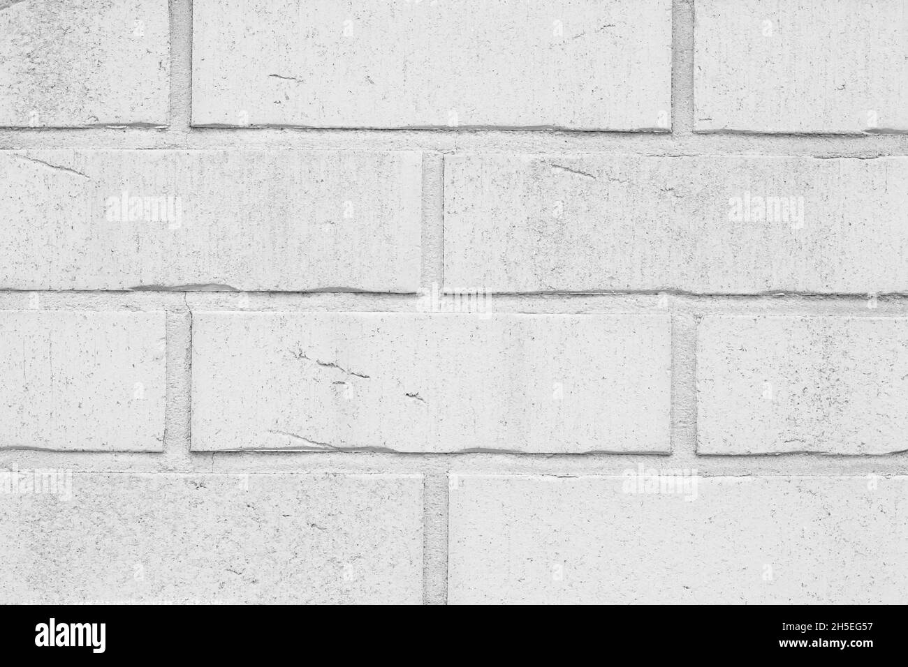 Weißer Backstein Wand Hintergrund, graue Textur. Abstrakte Hintergründe. Grunge Hintergrund, Architektur-Design. Strukturierte Oberfläche Stockfoto
