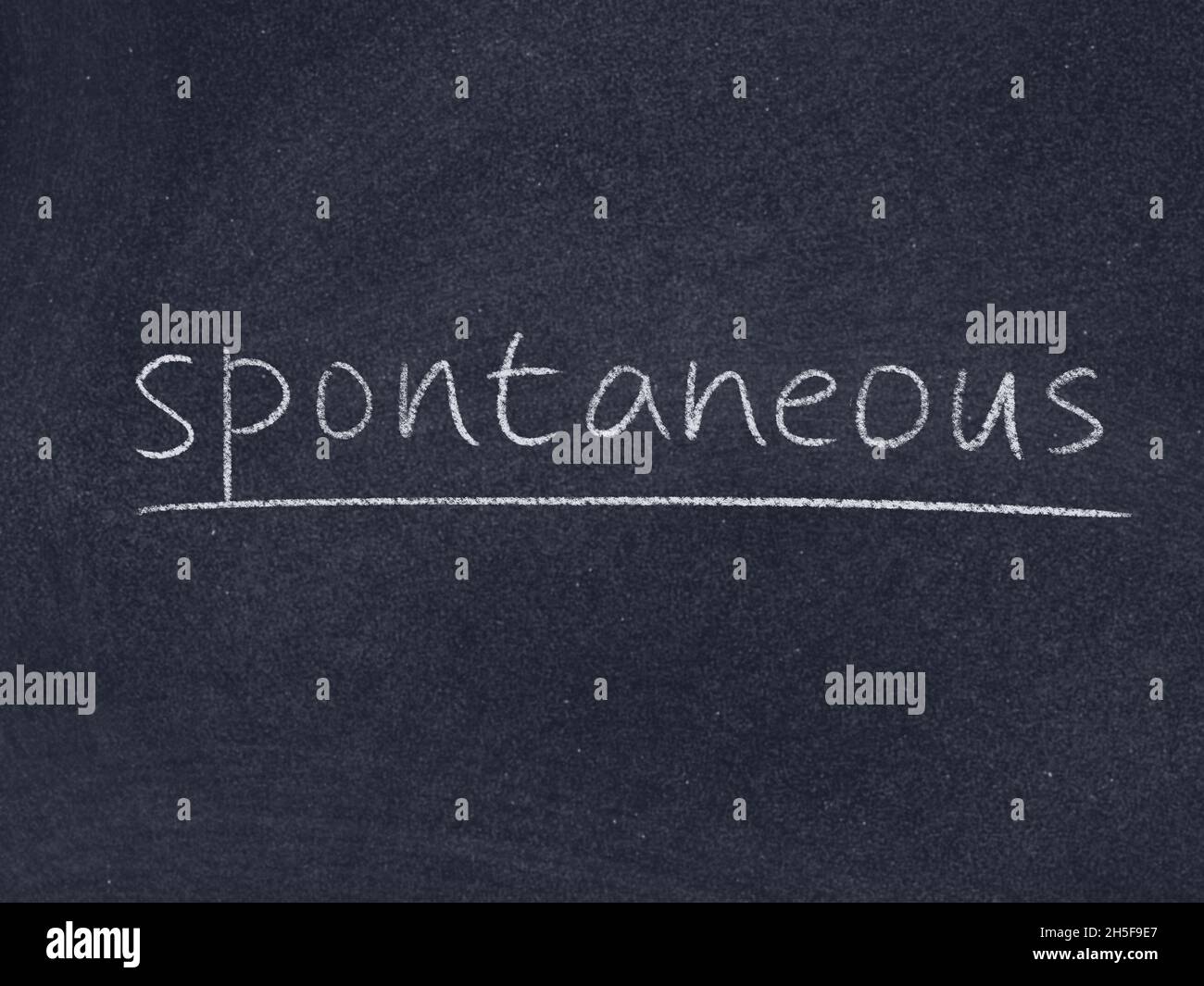 Spontanes Konzept Wort auf Tafel Hintergrund Stockfoto