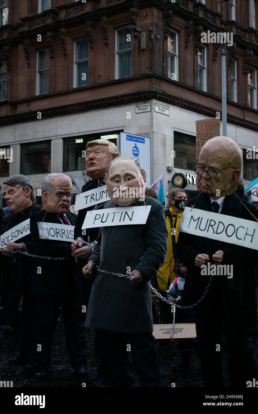 Das politische Satire steht immer im Mittelpunkt der Proteste, und die Klimamärsche an der COP26 in Glasgow sind nicht anders. Das sind verschiedene Weltführer. Stockfoto